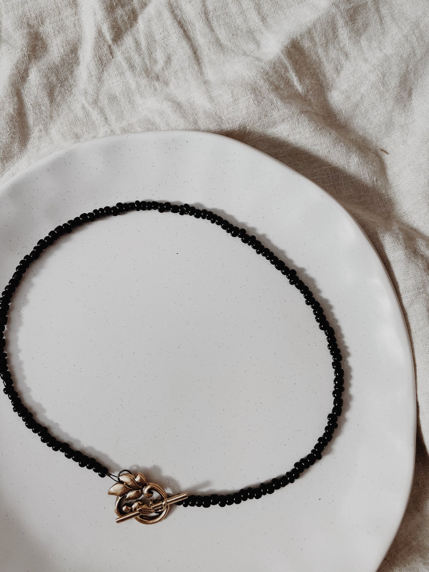 Black Beaded Gold Leaf Pendant Necklace